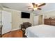 Bright bedroom featuring a television and a ceiling fan at 204 Mt Moriah Rd, Auburn, GA 30011