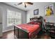 Bedroom with a ceiling fan, window, and hardwood floors at 204 Mt Moriah Rd, Auburn, GA 30011