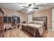 Bedroom features a ceiling fan, hardwood floors, and closet for storage at 204 Mt Moriah Rd, Auburn, GA 30011