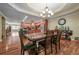 Well-lit dining room featuring hardwood floors, a ceiling fan, and decorative accents at 204 Mt Moriah Rd, Auburn, GA 30011