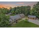 Expansive brick home on a large lot with two outbuildings and lush green landscaping at 204 Mt Moriah Rd, Auburn, GA 30011
