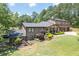 Charming two-story brick home with a covered porch and meticulously landscaped front yard at 204 Mt Moriah Rd, Auburn, GA 30011