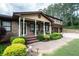 Inviting front porch with brick walkway, decorative plants, and ample seating at 204 Mt Moriah Rd, Auburn, GA 30011