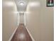 Hallway featuring hardwood floors and neutral colored walls at 204 Mt Moriah Rd, Auburn, GA 30011