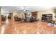 Open living space with hardwood floors, a cozy fireplace, and an adjacent dining area for seamless entertaining at 204 Mt Moriah Rd, Auburn, GA 30011