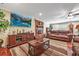 Inviting living room featuring a brick fireplace, plush seating, and ample natural light for a cozy atmosphere at 204 Mt Moriah Rd, Auburn, GA 30011