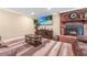 Comfortable living room boasts a brick fireplace, modern TV setup, and a soft rug for a relaxing ambiance at 204 Mt Moriah Rd, Auburn, GA 30011