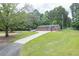 Spacious detached garage with multiple bays, a long driveway, and ample parking at 204 Mt Moriah Rd, Auburn, GA 30011