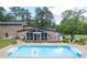 Backyard featuring a beautiful in-ground swimming pool, screened porch, and patio furniture at 204 Mt Moriah Rd, Auburn, GA 30011