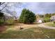 Spacious backyard with mature trees and lush lawn at 300 Maple Grove Ct, Canton, GA 30114
