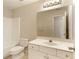 Bathroom with a white vanity, a large mirror, and a tub with a shower at 300 Maple Grove Ct, Canton, GA 30114