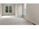 Spacious bedroom featuring neutral carpeting and large windows at 300 Maple Grove Ct, Canton, GA 30114