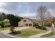Charming home with a two-car garage, landscaped yard, and inviting curb appeal in a residential area at 300 Maple Grove Ct, Canton, GA 30114