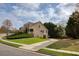 Two-story home with charming curb appeal and well-manicured lawn at 300 Maple Grove Ct, Canton, GA 30114
