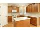 Functional kitchen features an island, white appliances, and ample cabinet space at 300 Maple Grove Ct, Canton, GA 30114