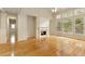 Spacious living room features hardwood floors, a fireplace, and large windows at 300 Maple Grove Ct, Canton, GA 30114