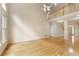 Bright and airy living room with hardwood floors and view of the upstairs railing at 300 Maple Grove Ct, Canton, GA 30114