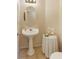 Powder room with pedestal sink and decorative accents at 300 Maple Grove Ct, Canton, GA 30114