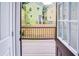 A view of the back deck leading to the yard with fence, from the interior of the home at 1166 Mcdaniel Sw St, Atlanta, GA 30310