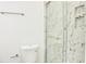 Modern bathroom featuring a sleek glass shower with marble-patterned tiling and a white toilet at 1166 Mcdaniel Sw St, Atlanta, GA 30310