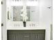 Elegant bathroom with double vanity sinks and a large mirror, offering modern fixtures at 1166 Mcdaniel Sw St, Atlanta, GA 30310