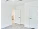 Bedroom featuring neutral decor, wood-look floors, and a ceiling fan, with open doors at 1166 Mcdaniel Sw St, Atlanta, GA 30310