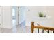 Hallway featuring wood-look floors and classic wood and iron railing, with decorative grass at 1166 Mcdaniel Sw St, Atlanta, GA 30310