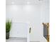 Bright hallway with staircase, plant, and wood-look flooring provides a spacious open area at 1166 Mcdaniel Sw St, Atlanta, GA 30310