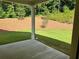 Backyard featuring a well-maintained lawn and privacy from mature trees at 3032 Farm Tract Trl, Woodstock, GA 30189