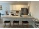Open concept kitchen with granite countertops, white cabinets, and stainless appliances at 3032 Farm Tract Trl, Woodstock, GA 30189