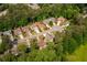 An aerial view of a well-manicured neighborhood featuring mature trees and established homes on a cul-de-sac at 3167 Blairhill Ct, Atlanta, GA 30340