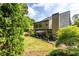 Beautiful backyard with a lush lawn, patio seating, and vibrant landscaping offering a tranquil outdoor space at 3167 Blairhill Ct, Atlanta, GA 30340