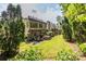 An inviting backyard with a well-manicured lawn, privacy landscaping, and an outdoor patio area for entertaining at 3167 Blairhill Ct, Atlanta, GA 30340