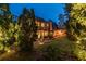 Serene backyard illuminated at twilight, featuring a stone patio and lush landscaping at 3167 Blairhill Ct, Atlanta, GA 30340