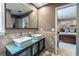 Bathroom with double sinks, walk-in shower and large framed mirror at 3167 Blairhill Ct, Atlanta, GA 30340