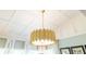 Custom gold light fixture in sitting room with large windows at 3167 Blairhill Ct, Atlanta, GA 30340