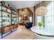 Bright dining area with a table, chairs, shelving, and an open view to the living room at 3167 Blairhill Ct, Atlanta, GA 30340