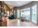 Bright dining area with large windows, a stylish light fixture, and cozy seating at 3167 Blairhill Ct, Atlanta, GA 30340