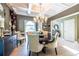 Elegant dining room features coffered ceilings, chandelier, and stylish furniture at 3167 Blairhill Ct, Atlanta, GA 30340