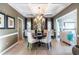 Formal dining room with coffered ceiling, round table, and elegant chandelier at 3167 Blairhill Ct, Atlanta, GA 30340