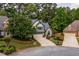 Beautiful home with stone detailing, manicured lawn, and a neatly paved driveway in a lovely neighborhood at 3167 Blairhill Ct, Atlanta, GA 30340