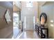 Bright, two-story foyer with tile flooring, designer mirrors, and a charming entryway at 3167 Blairhill Ct, Atlanta, GA 30340
