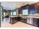 Gourmet kitchen with stainless steel appliances, dark wood cabinetry, and mosaic backsplash at 3167 Blairhill Ct, Atlanta, GA 30340