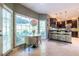 Open concept kitchen with a marble table, modern light fixture, and bar seating at 3167 Blairhill Ct, Atlanta, GA 30340