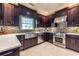 Well-equipped kitchen with stainless steel appliances and dark wood cabinets at 3167 Blairhill Ct, Atlanta, GA 30340