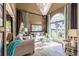 Bright living room with large window, vaulted ceiling, chandelier, and stylish decor at 3167 Blairhill Ct, Atlanta, GA 30340