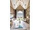 Stylish living room featuring a vaulted ceiling, a large picture window, and elegant decor at 3167 Blairhill Ct, Atlanta, GA 30340
