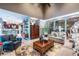Open living room with a view of the kitchen, bar, fireplace, and lots of natural light at 3167 Blairhill Ct, Atlanta, GA 30340