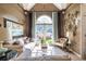 Stylish living room featuring a vaulted ceiling, a large picture window, and elegant decor at 3167 Blairhill Ct, Atlanta, GA 30340