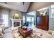 Cozy living room with a fireplace, vaulted ceilings, warm colors, and comfortable seating at 3167 Blairhill Ct, Atlanta, GA 30340